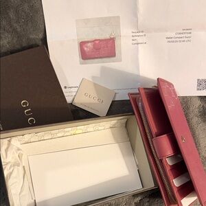 Gucci Pink Leather Wallet 7” length with zipper and snap closure
4” wide